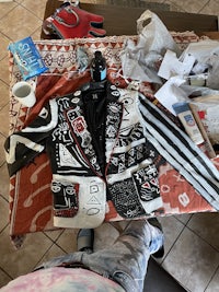 a person sitting on a table with various items on it