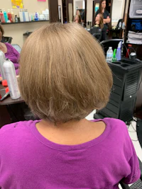 the back of a woman's hair in a salon