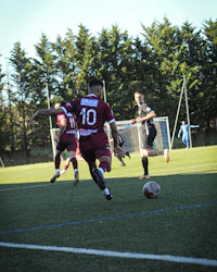 a group of men playing soccer on a field