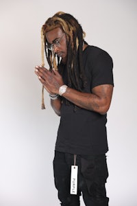 a man with dreadlocks in the air