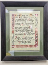 a framed piece of paper with a poem on it