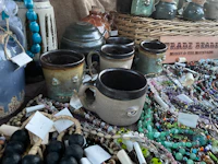 mugs and beads on a table