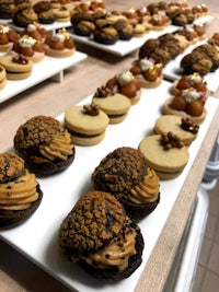trays of cookies and desserts on a table