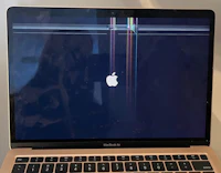 an apple macbook pro with a broken screen