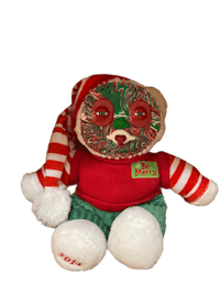 a stuffed animal wearing a christmas hat