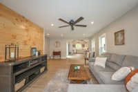 a living room with a ceiling fan
