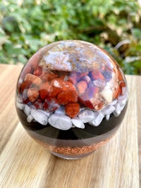 a glass sphere filled with rocks and pebbles