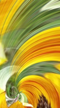 a blurry image of yellow and green flowers