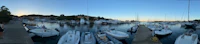 a group of boats docked in a marina
