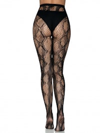 the back view of a woman wearing black fishnet stockings