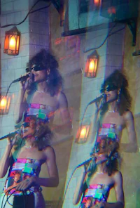 a woman is singing into a microphone