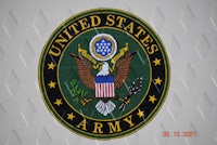 the united states army logo is shown on a white wall