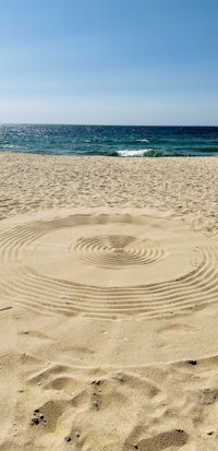 a circle of sand on a beach
