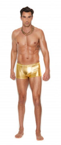 a man in gold shorts posing for a photo