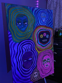 a painting on a table with colorful lights on it