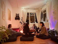 a group of people sitting on the floor in a room