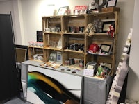 a display of crates and a painting on a table