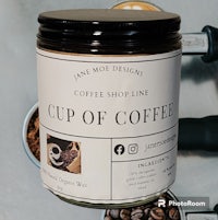 a jar of coffee next to a cup of coffee