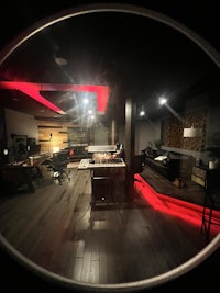 a view of a recording studio with red lights
