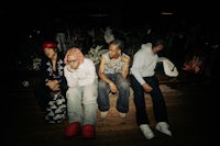 a group of people sitting on a bench