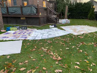 a pile of papers on the ground in front of a house