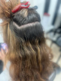 the back of a woman's hair in a salon