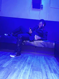 a man laying on a couch