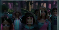 a group of barbie dolls in a dark room