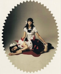 japanese girl in uniform laying on the ground