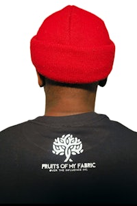 the back of a man wearing a red beanie