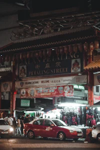 cars parked in front of a chinese shop