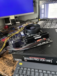 a computer with a motherboard and a keyboard on top of it