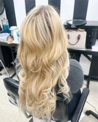 the back of a woman's hair in a salon