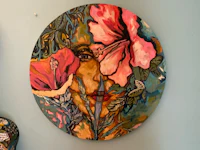 a clock with a woman's face painted on it