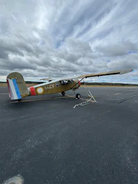 a small airplane is parked on the tarmac