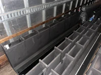 a large number of black boxes in a warehouse