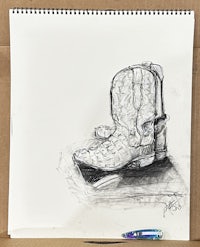 a drawing of a cowboy boot on a piece of paper