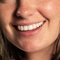 a close up of a woman with a smile on her face
