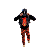 a man in camouflage pants and a hat