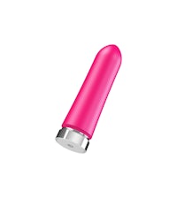 a pink sex toy on a white background