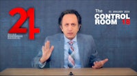 a man in a suit is standing in front of a desk with the words 24 control room