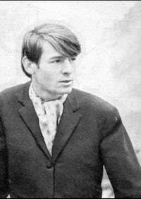 a black and white photo of a man in a suit