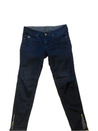 a pair of dark blue jeans with zippers