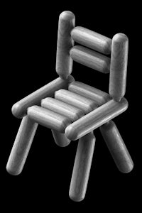 a wooden chair on a black background