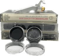 a box containing a camera, a camera lens, and a pair of glasses