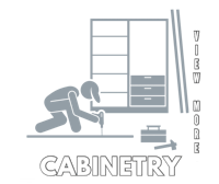 a black and white image of a man working on a cabinet