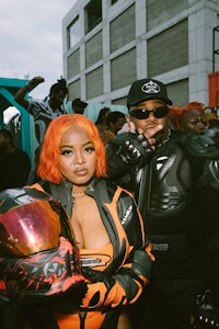 two people with orange hair standing next to each other