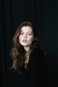 a young woman is posing for a photo