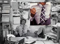 a man in a tie sitting on a chair in his office