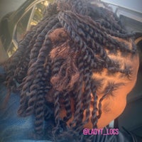 a woman in a car with her hair in braids